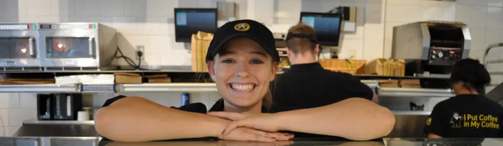 Einstein Bros. employee happy to greet our guests